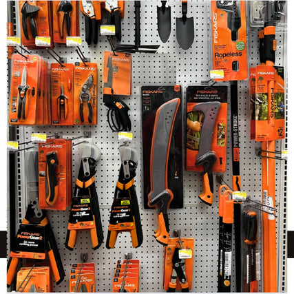 Lawn & GardenA selection of various gardening tools displayed on a wall in Helena Hardware.